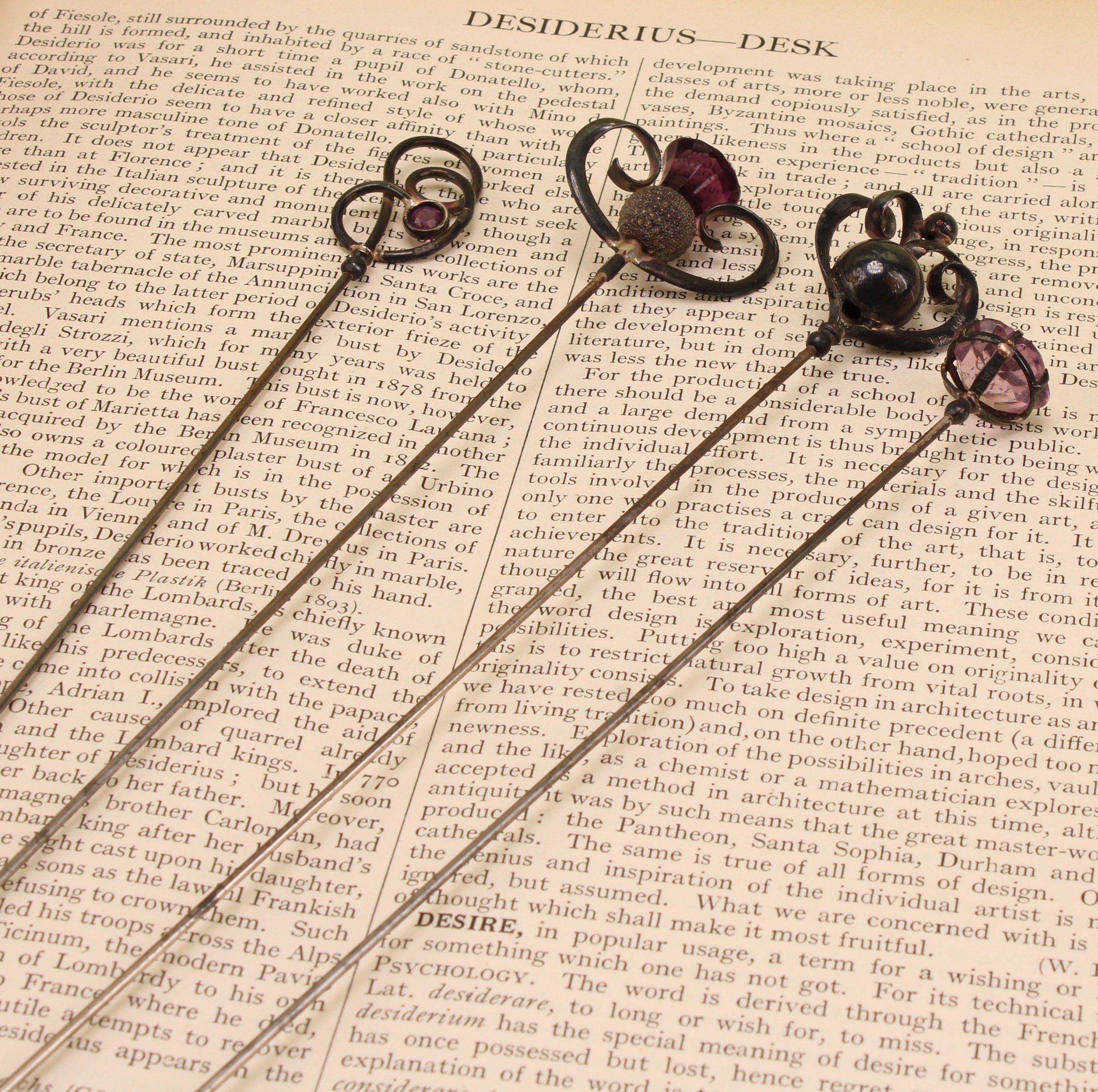 Charles Horner - a Edwardian silver thistle topped hat pin, set with amethyst, 27cm long, Chester 1910; other Charles Horner silver topped hat pins (4)