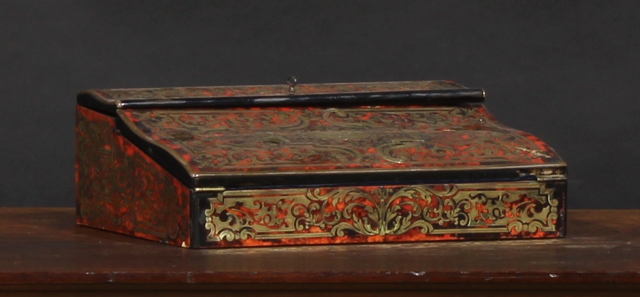 Royal Ownership - Queen Victoria - a 19th century Boulle writing box or lap desk, the hinged cover and folding serpentine top enclosing a fitted interior, the slope enclosing two small secret drawers, the cartouche inscribed 'Empress of India', the lock 'Happy Birthday Dearest Mama, 24th May 1876', 33.5cm wide, c.1875