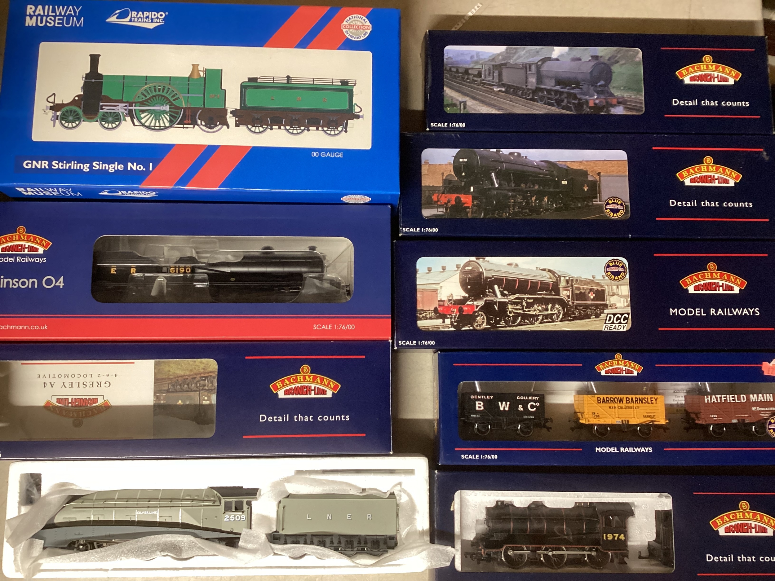 Bachmann model railway interest and Rapido train, to include ; 2509 Silver link, a 31-003 Robinson LNER, a GNR Stirling silver loco and tender made for the Railway museum , a 1469 31-860 LNER loco and tender , A 32-256 Austerity BR,  a K3 32-275 Black 2934 set,  a 31-855 LNER set, and a 3  wagon pack 37-105 boxed set ( 8 items)