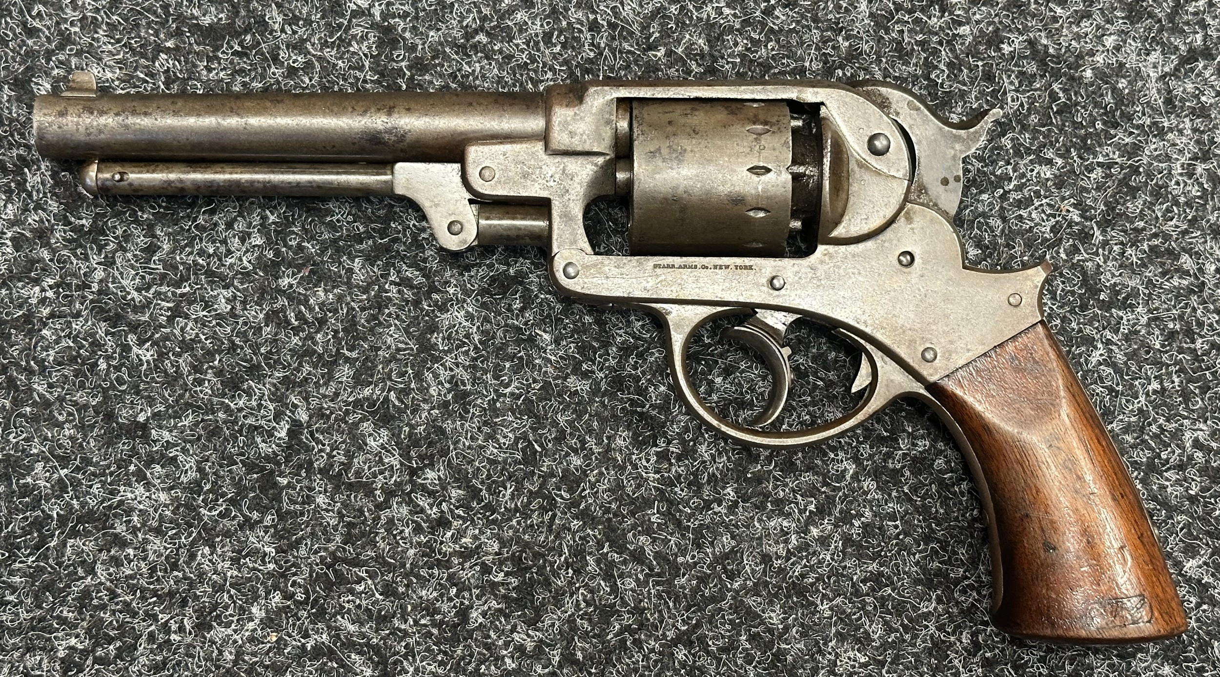 US Civil War Era Starr M1858 .44 Cal Double Action Percussion Cap Revolver serial number 14376. Matching Serial numbers to both upper and lower frame, barrel and cylinder. Frame marked "Starr Arms Co. New York" and "Starrs Patent Jan.15th 1856". Working action. Barrel length 150mm. Inspection marks to both wooden grips. Overall length 293mm. NOTE: Section 58 (2) No licence required in the UK.