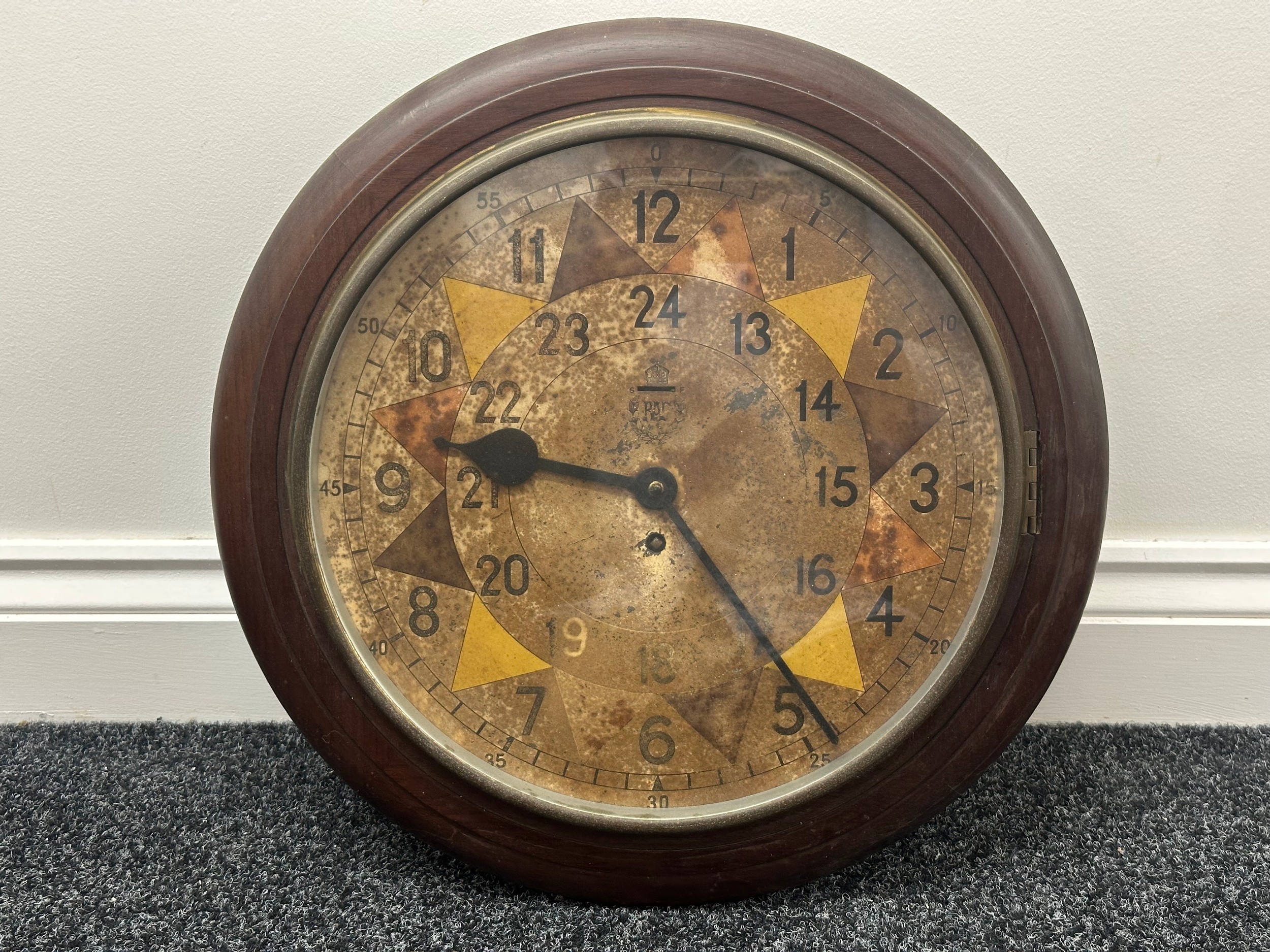 WW2 British RAF Sector Clock with coloured enamel dial with Kings Crown and RAF. The clock dial is marked with five-minute red, yellow and blue triangular segments. It has an outer 12-hour ring and an inner 24-hour dial. Maker marked to reverse of case "Smith 1942" along with "GR VI". Overall size 45cm in diameter. Original un-restored condition. No key. Runs and ticks, would recommend a clean and service.