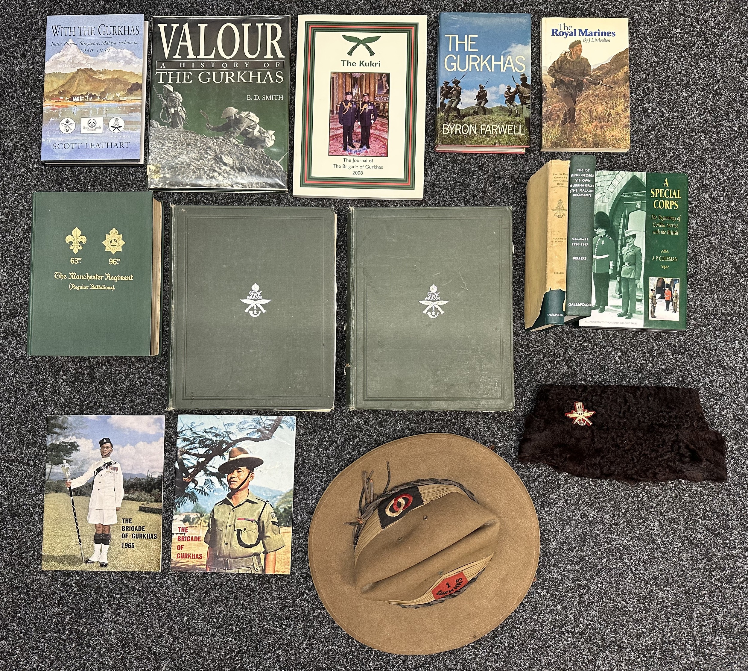 WW2 British Gurhka Rifles Group consisting of: 1st Gurhka Rifles Bush Hat with all original insignia of "1st Gurhka" and 36th Infantry Division formation sign, maker marked and dated "WA Hatton Ltd, Atheston 1941" Size 6 3/8ths. Twisted leather cords to cap. Along with his Officers brown Fur side cap with 1st King George V's Own Gurkha Rifles Gurkha Rifles Regiment Cap Badge, no markings: Books x 11 plus two booklets on the Brigade of Gurkhas 1965. New to the market.