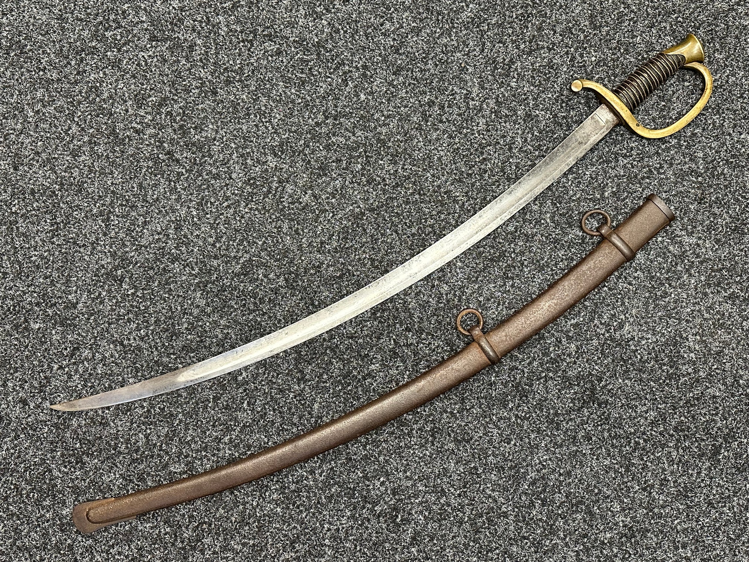 US Civil War M1840 Pattern Artillery Officers Sword with curved fullered single edged blade 814mm in length, marked "US 1861" along with Inspection mark "GGS" for George G. Saunders. Maker marked for "Ames Mfc.Co, Chicopee, Mass". Wire bound leather grip. Brass guard. Overall length 945mm. Complete with original metal scabbard with twin suspesion rings with light rust pitting overall.