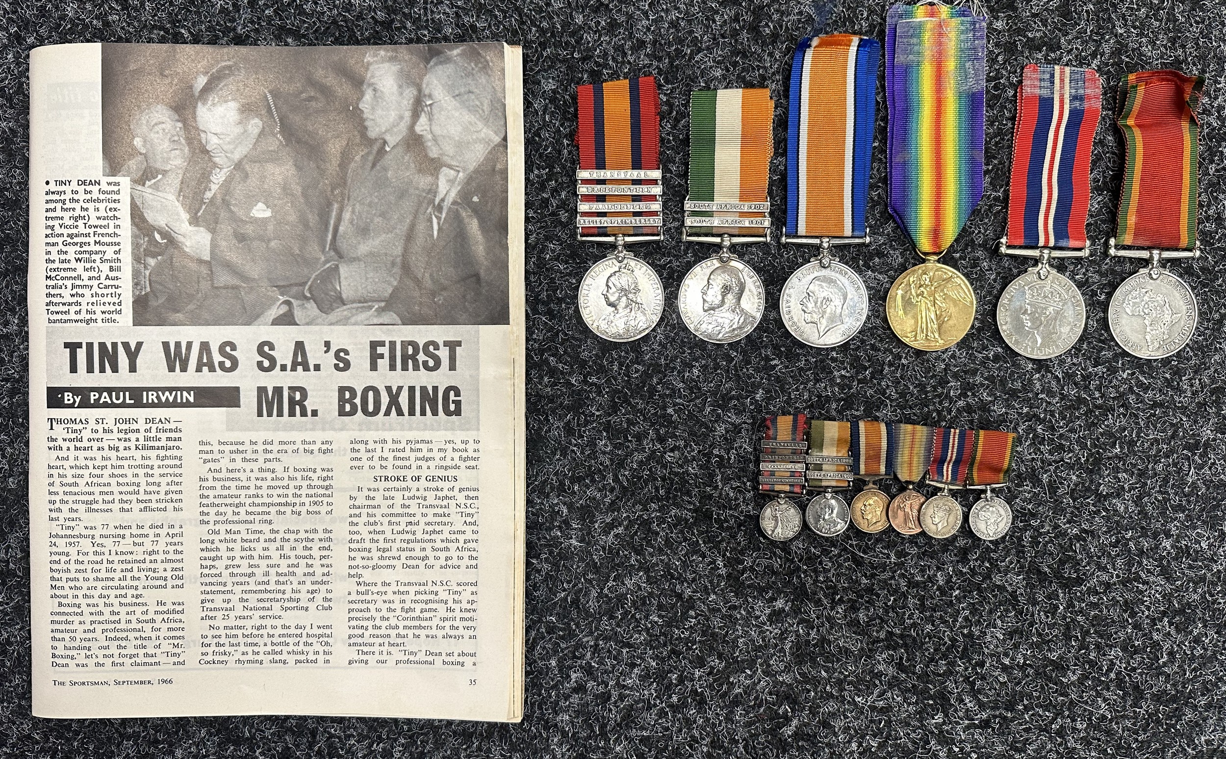 South African Boer War/WW1/WW2 Medal Group comprising of Queens South Africa Medal with Tranvaal, Driefontein, Paardeberg and Relief of Kimberly Clasps, Kings South Africa Medal with South Africa 1901 and South Africa 1902 Clasps, WW1 War Medal and Victory Medal, (As a 2nd Lt) WW2 Africa Service Medal and War Medal (As 225300 T St J Dean) all to "12016 Pte T Dean, RAMC". Along with a matching set of Miniatures. All complete with ribbons. Along with a 1966 article in the South African Sportsman magazine about his life in Boxing. Thomas St. John "Tiny" Dean  died in 1957.