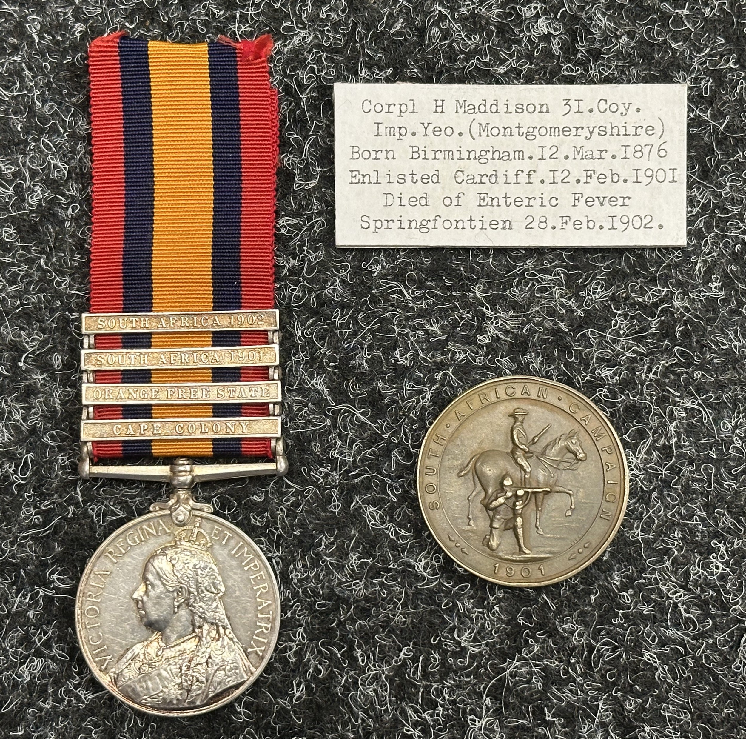 Victorian Queens South Africa Medal with South Africa 1902, South Africa 1901, Orange Free State and Cape Colony Clasps impressed to "25460 Corpl H Maddison, 31st Coy. Imperial Yeomanry". Complete with ribbon. Along with a scarce Bronze Medallion "Mongomeryshire Imperial Yeomanry South Africa Campaign 1901". Together with several pages of research.
