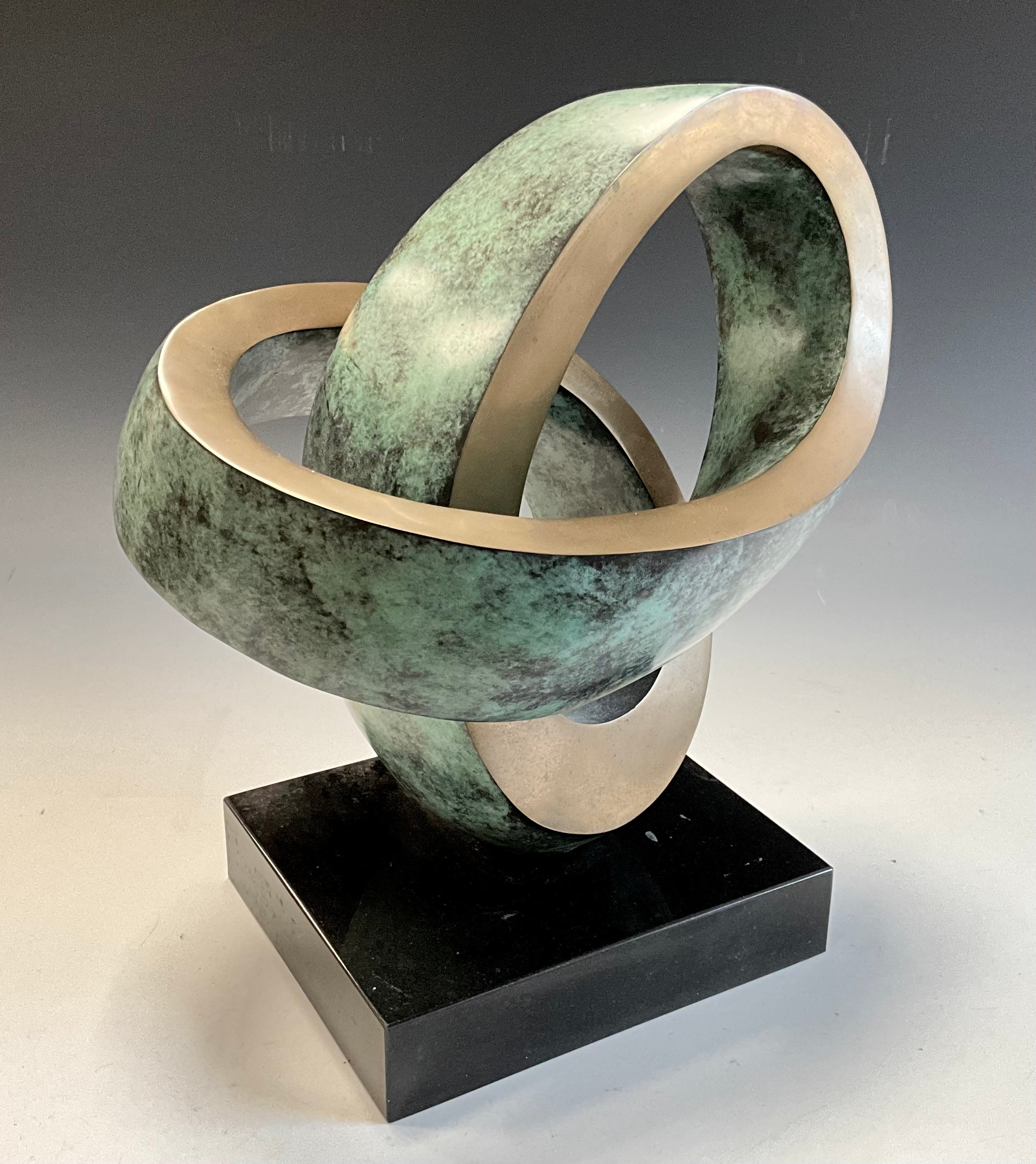 Dennis Westwood (1928-2021)  Continuance Patinated Bronze Sculpture, black marble base, 35.5cm high, 30cm wide, 23cm deep.  ARR apply to this lot.