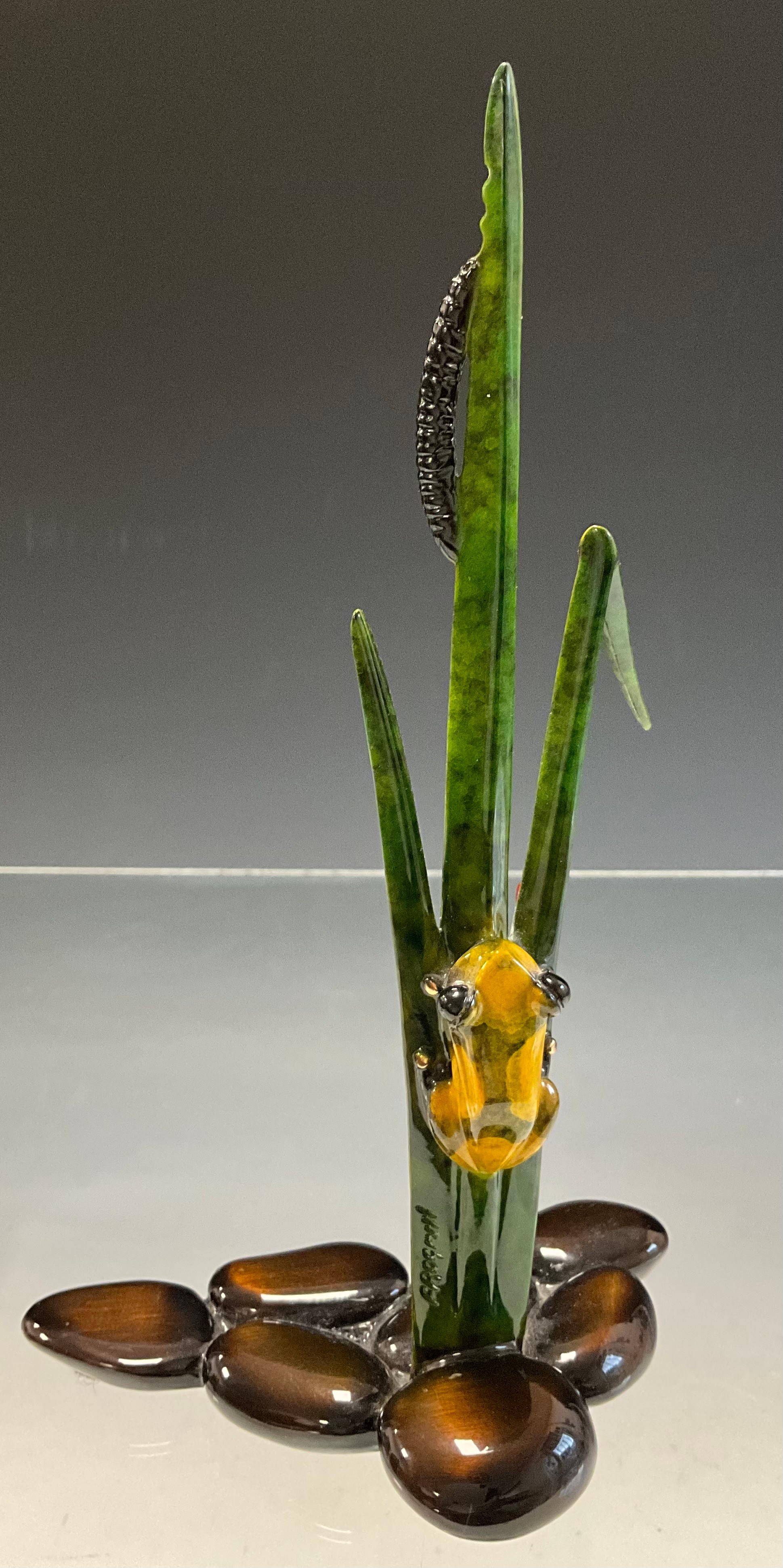 Tim 'Frogman' Cotterill; a limited edition lost wax cast bronze model 'Sprout', of a frog with a yellow and black hue patina, climbing rush stems, a black Caterpillar above, pebble form base,  1251/5000, signed, numbered and impressed, approx 22cm high, 19cm wide, with certificate Mulberry Hall, 11/11/15