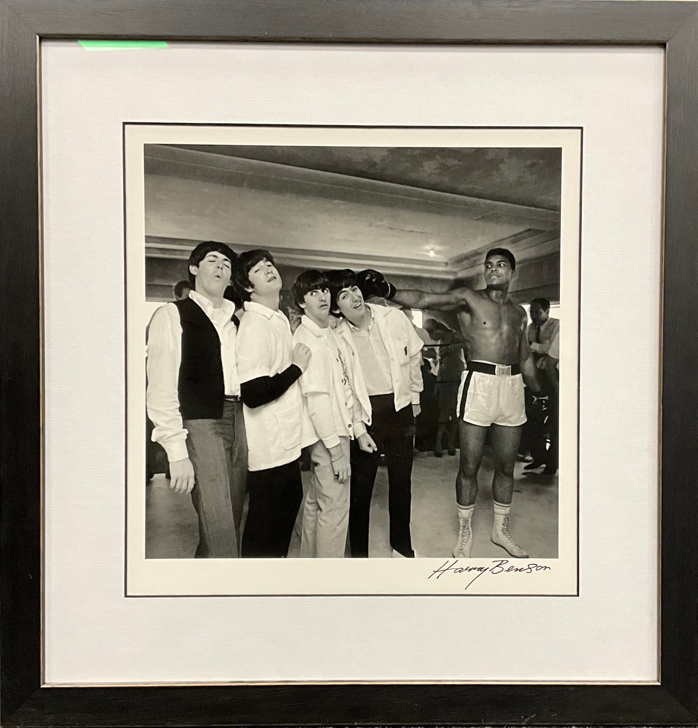 Harry Benson, by and after,  Ali hits George, Miami,  photographic print, signature lower right margin, 32cm x 31cm (49.5cm x 48cm frame size).