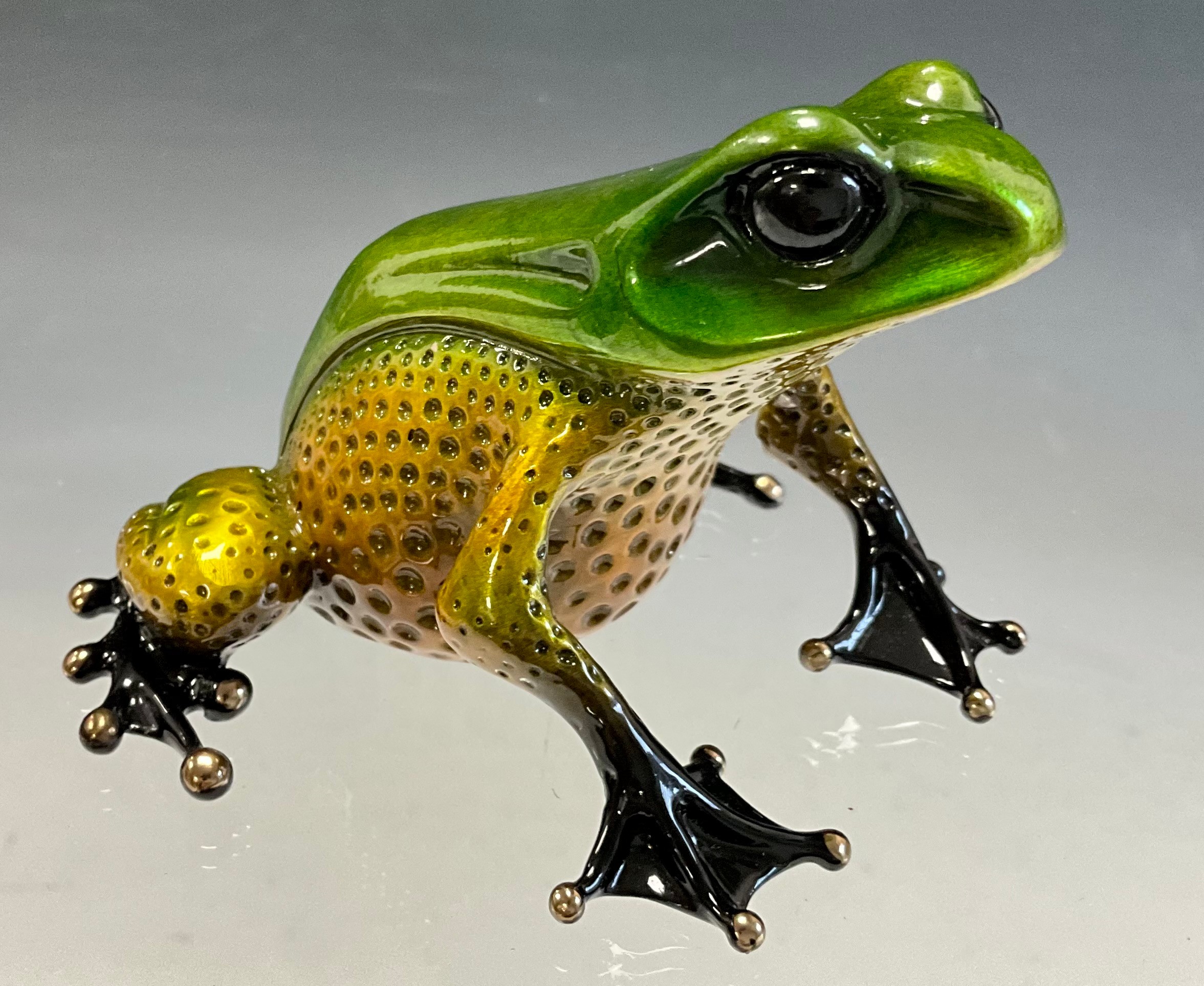 Tim 'Frogman' Cotterill; a limited edition lost wax cast bronze model 'El Gordo', of a frog with a green and golden hue patina, 466/500, signed, numbered and impressed on the underside, approx 6.5cm high, 9cm long, with certificate Mulberry Hall, 22/03/08