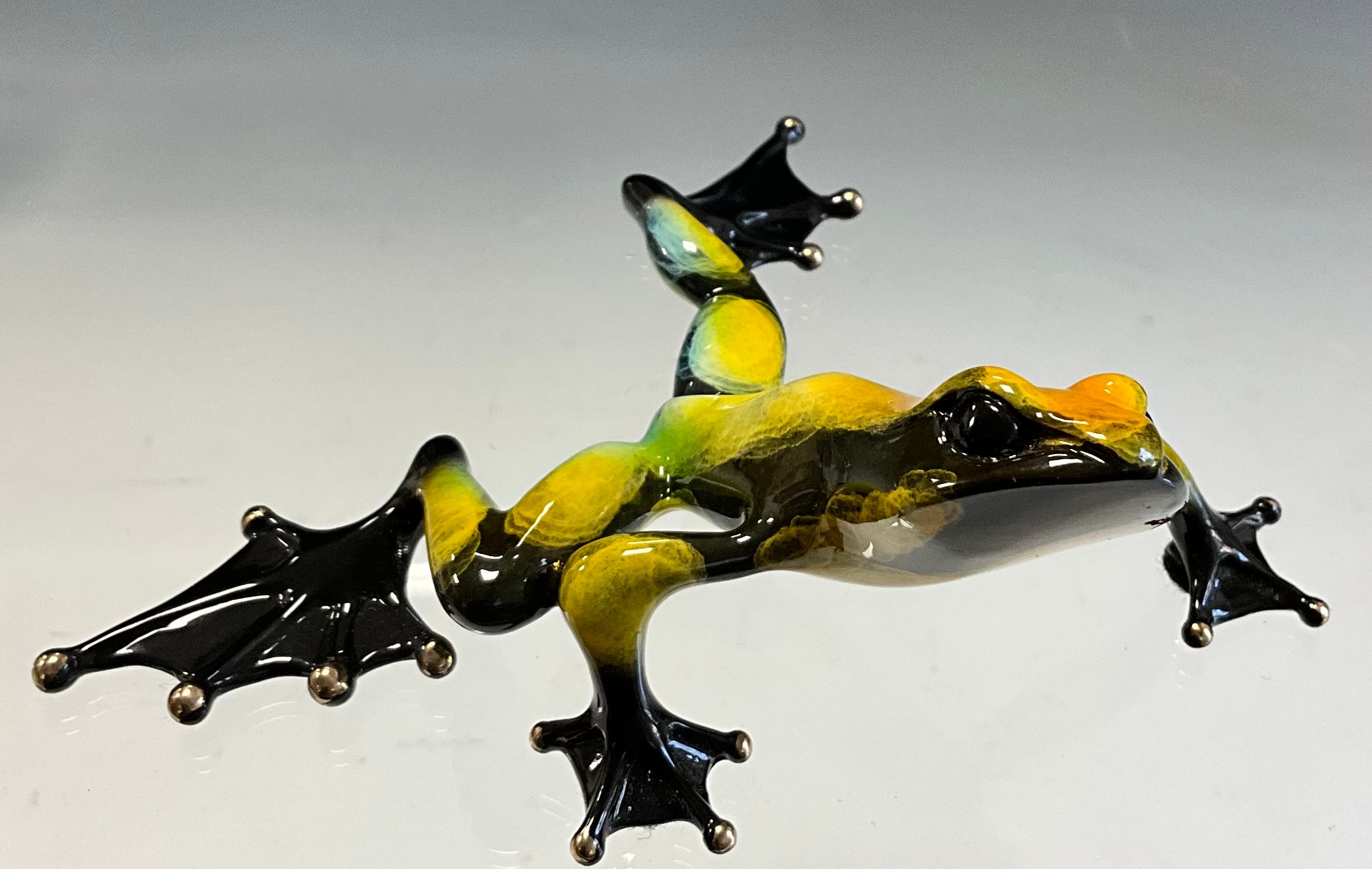 Tim 'Frogman' Cotterill; a limited edition lost wax cast bronze model 'Zoro (Zorro)', of a Frog with golden yellow, turquoise and black hue patina, limited edition numbered 501/2500, signed and impressed marks, approx 11cm long, 14cm wide, with certificate Mulberry Hall, 19th April 08