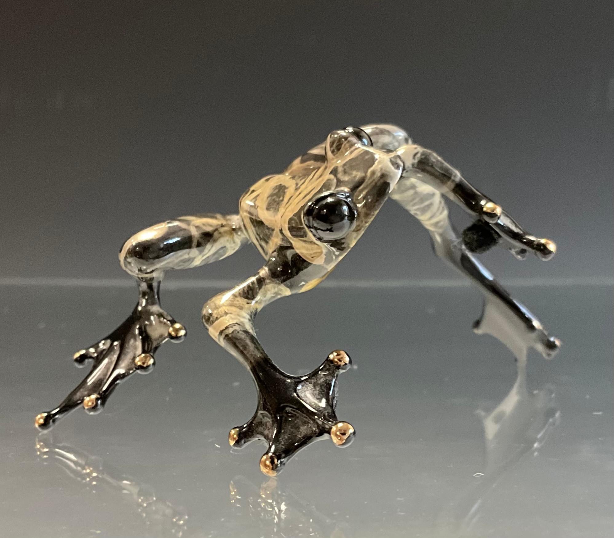 Tim 'Frogman' Cotterill; a limited edition lost wax cast bronze model 'Shadow', of a Frog with grey and black hue patina, Variant number 175/250, limited edition number 4529/5000, signed and impressed marks, approx 12cm long, 7.5cm wide, with certificate Mulberry Hall, 16/06/11