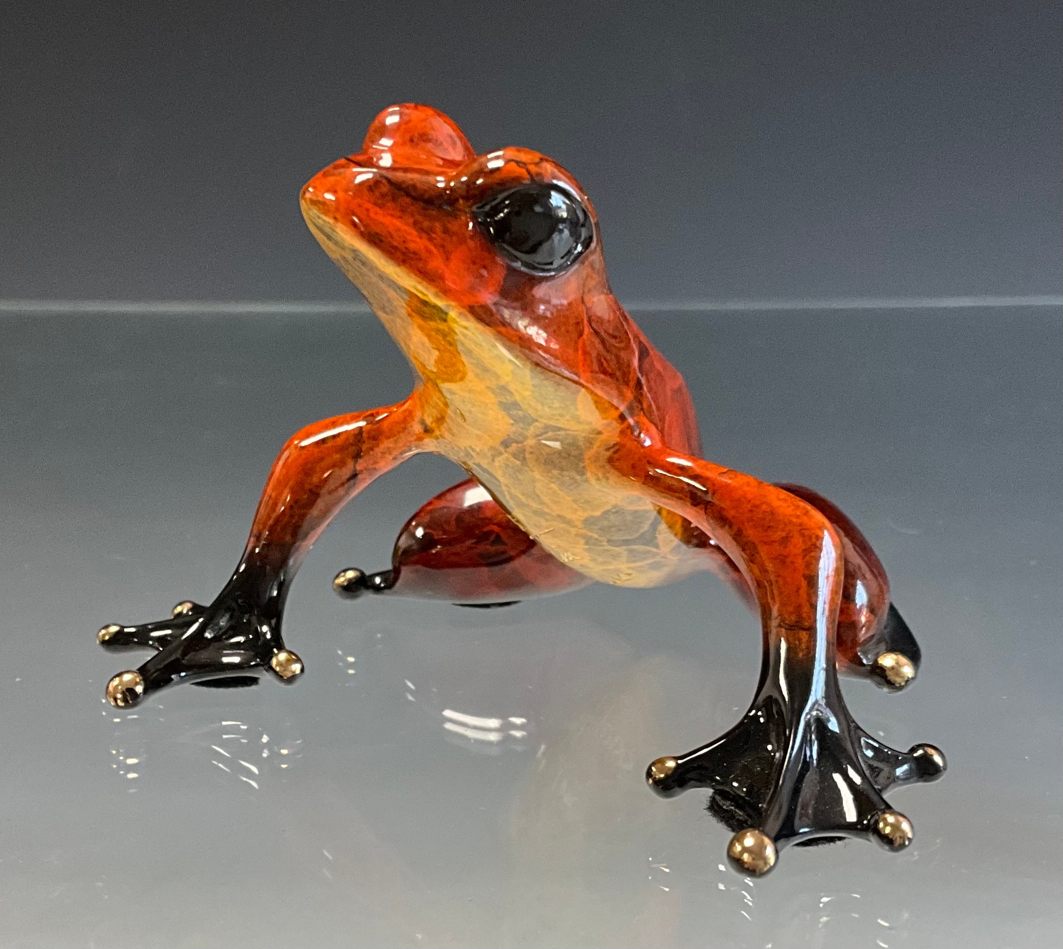Tim 'Frogman' Cotterill; a limited edition lost wax cast bronze model 'Pippin', of a Frog red and black hue patina standing, numbered 197/1000, signed and impressed marks to base, approx 6cm high, 19cm wide, with certificate Mulberry Hall, 25/01/07
