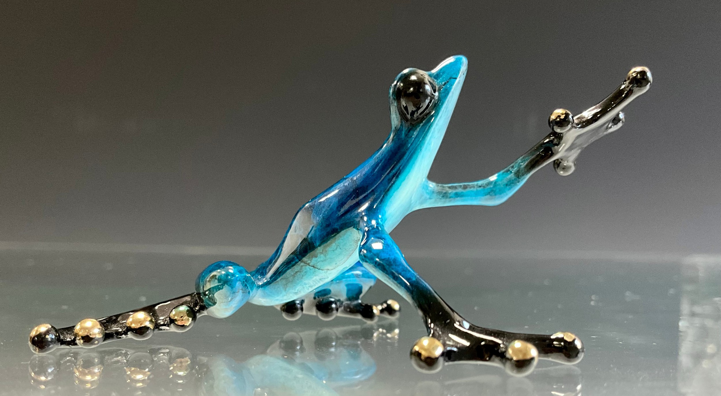 Tim 'Frogman' Cotterill; a limited edition lost wax cast bronze model 'Sky', of a Frog standing with blue and black hue patina, limited edition, numbered 3297/5000, signed and impressed marks, approx 8.5cm long, 6cm wide, with certificate Mulberry Hall, 09/05/08