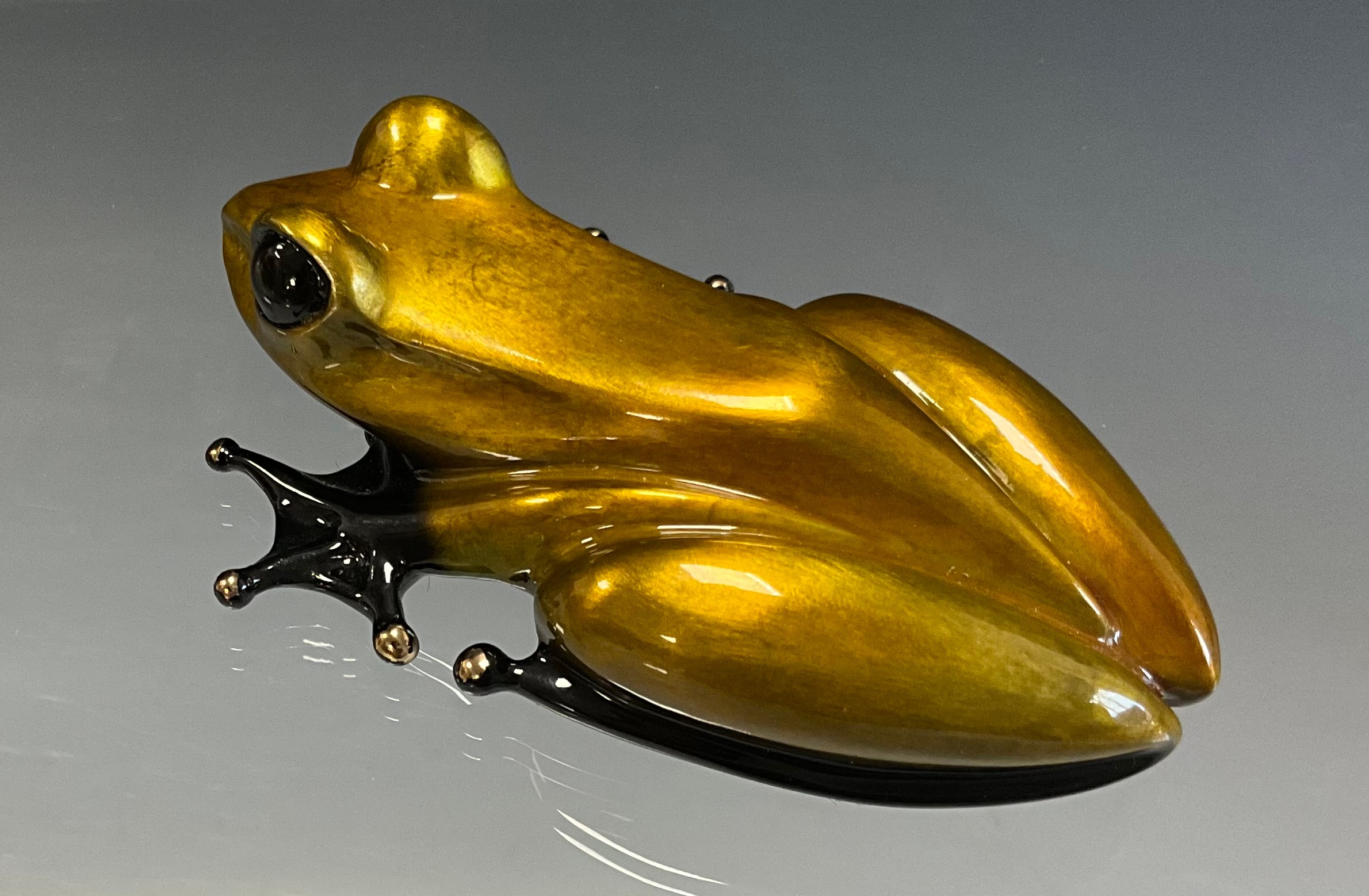 Tim 'Frogman' Cotterill; a limited edition lost wax cast bronze model 'Golden Nugget', of a Frog with gold and black hue patina, variant number 32/100, limited edition numbered 232/5000, signed and impressed marks, approx 8.5cm long, 5.5cm wide, with hand signed certificate Mulberry Hall, 07/08/06