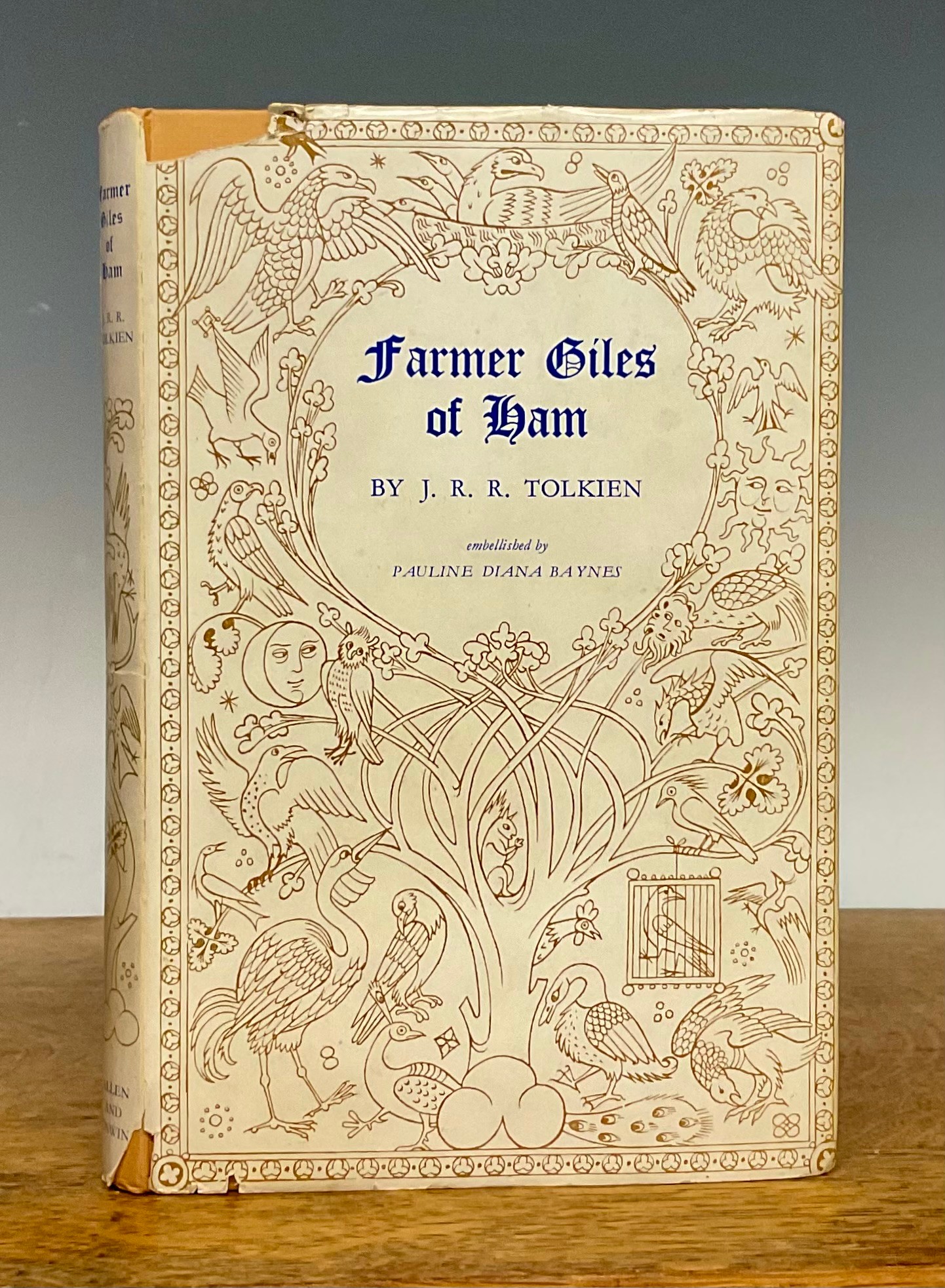 Book – Modern first editions: Tolkein (Professor J R R), Farmer Giles of Ham, The rise and wonderful adventures of Farmer Giles, Lord of Tame, Count of Worminghall and King of the Little Kingdom, embellished by Diana Baynes, 1st edn., London, George Allen and Unwin, 1949, 12mo, 79pp, decorative endpapers, bound yellow cloth with blue dragon to front board, blue titles to spine, d. w. (slight tears, at top and lower end of spine, slight staining to endpapers and edges), variety of associated newspaper and other cuttings tucked in (1)