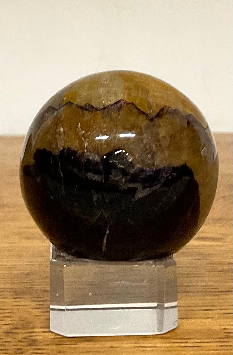 Natural History - a Blue John geological specimen, mounted for display, the stone 3.5cm diameter