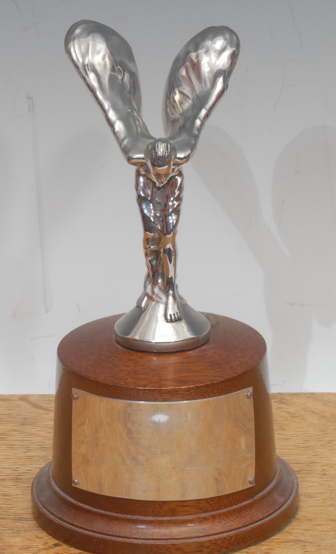 A Rolls Royce chrome plated presentation car mascot, Spirit of Ecstasy, after Charles Robinson Sykes (1875-1950), mounted for display, the base inscribed G. SMITH/FROM FRIENDS AND COLLEAGUES AT THE P.C.F., 18cm high overall