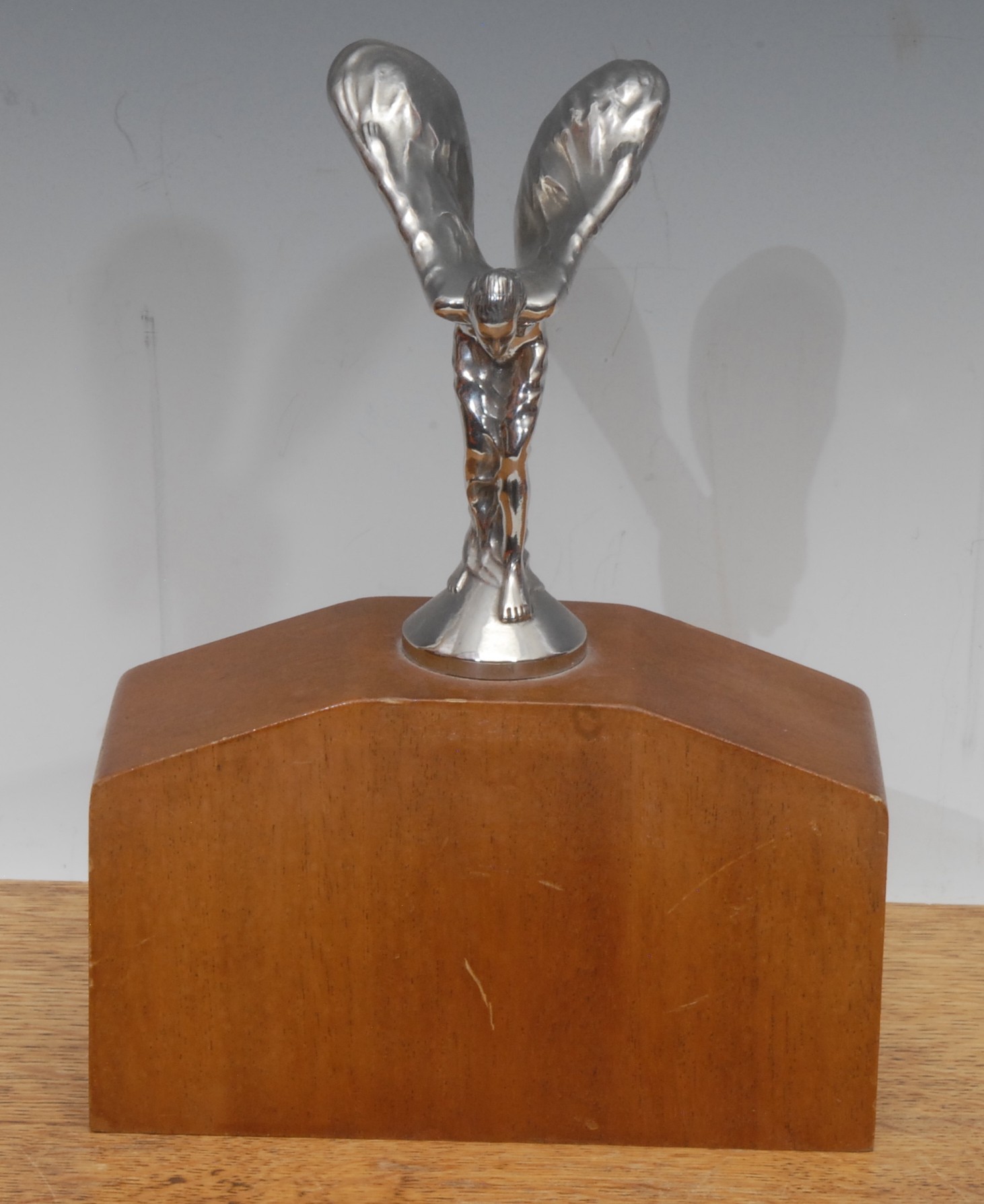 A Rolls Royce chrome plated car mascot, Spirit of Ecstasy, after Charles Robinson Sykes (1875-1950), mounted for display, 20cm high overall