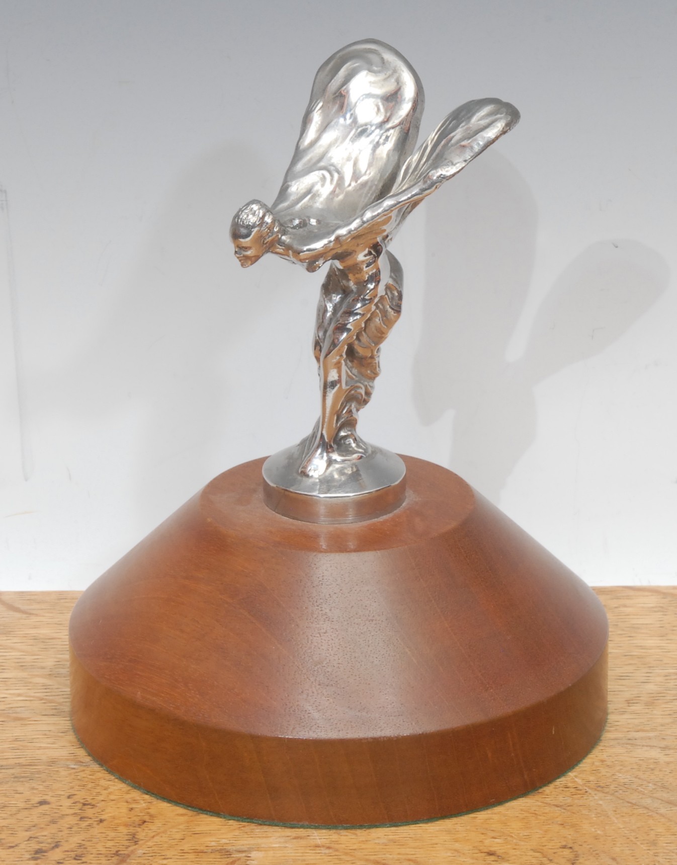 A Rolls Royce chrome plated car mascot, Spirit of Ecstasy, after Charles Robinson Sykes (1875-1950), mounted for display, 18.5cm high overall