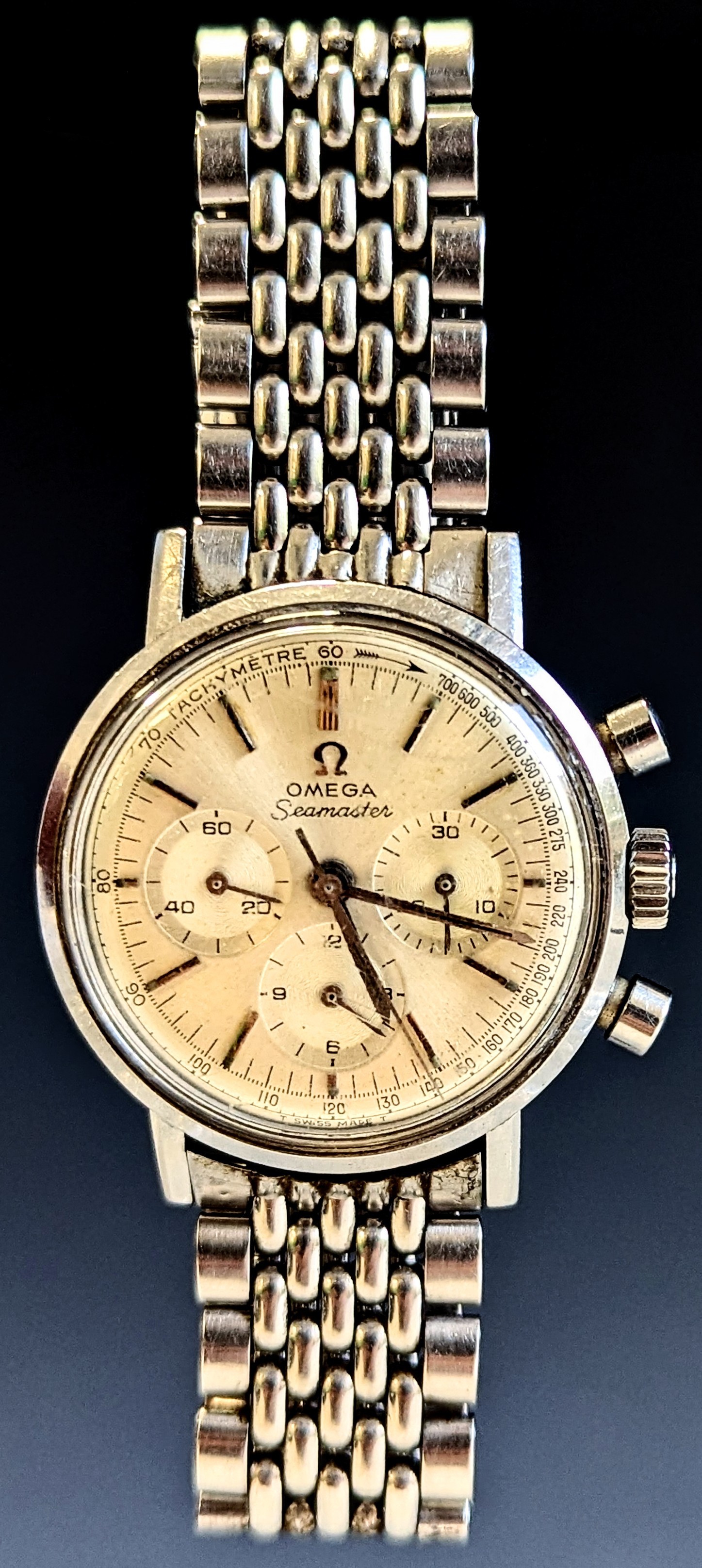 Omega - a Seamaster Chronograph stainless steel gentleman's wristwatch, circa 1960s, silvered dial with raised baton indices, tachymetre scale, centre seconds and triple subsidiary registers, cal. 321 manual wind movement, engraved Waterproof screw back 34mm diameter case, signed crown, two button pushers, with Omega 1036 signed bracelet