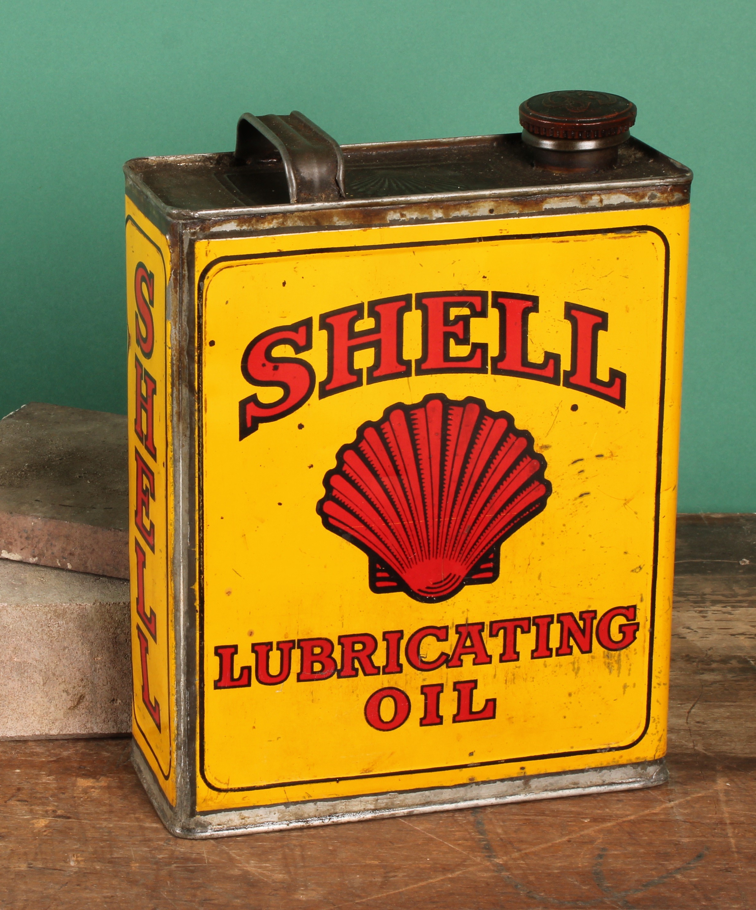 Petroliana - a vintage rectangular oil can, SHELL LUBRICATING OIL, illustrated with Shell trade mark, associated cap, 29cm high, first half 20th century